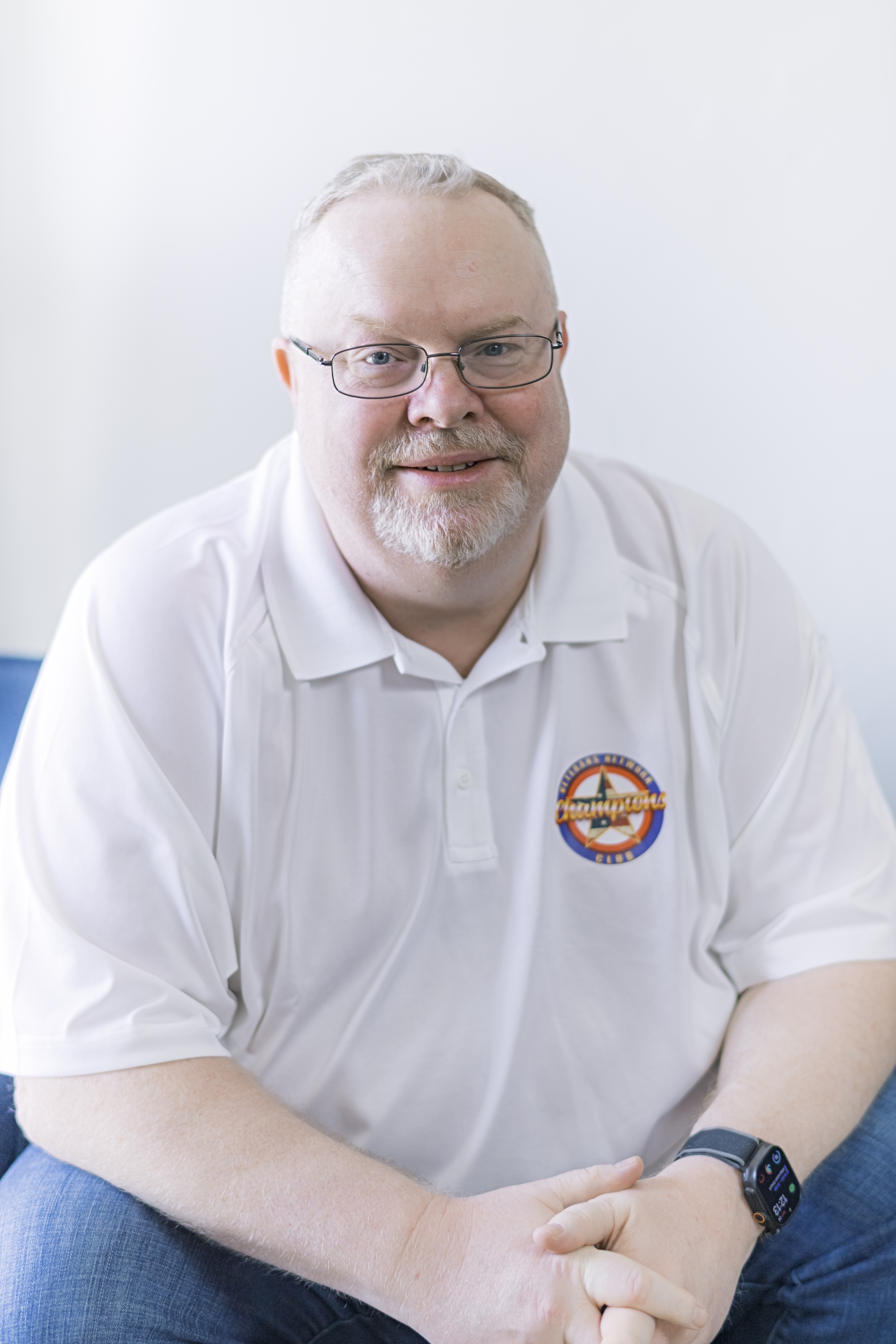 Senior Benefits Advisor Brian with team shirt