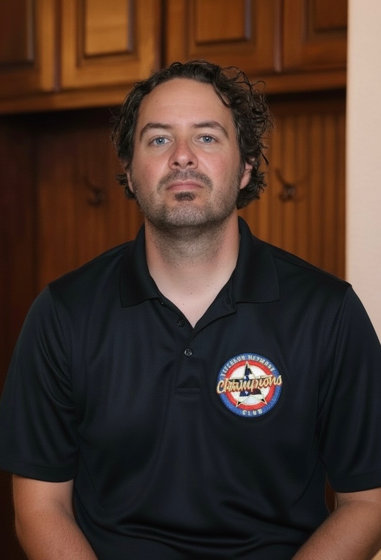 Senior Benefits Advisor David with team shirt