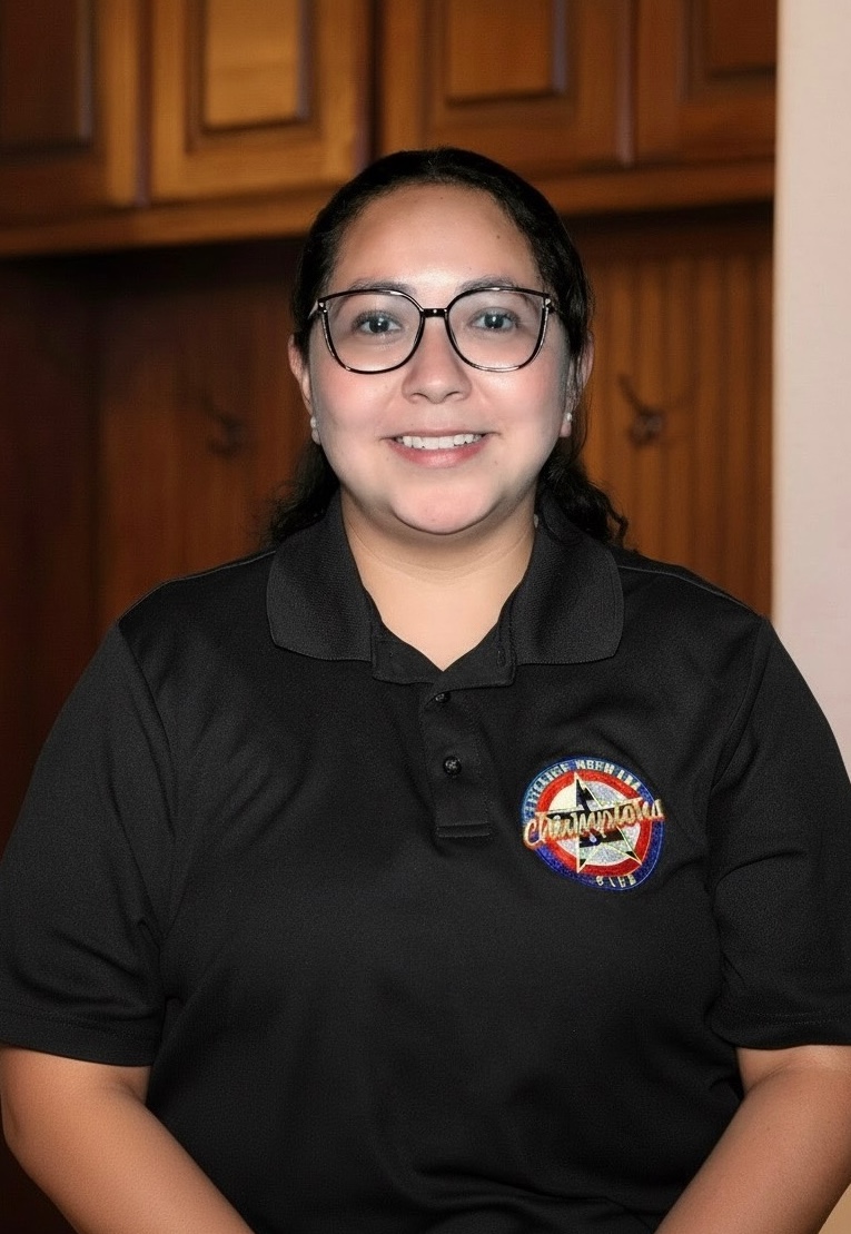 headshot picture of Maria with VNCC team shirt 